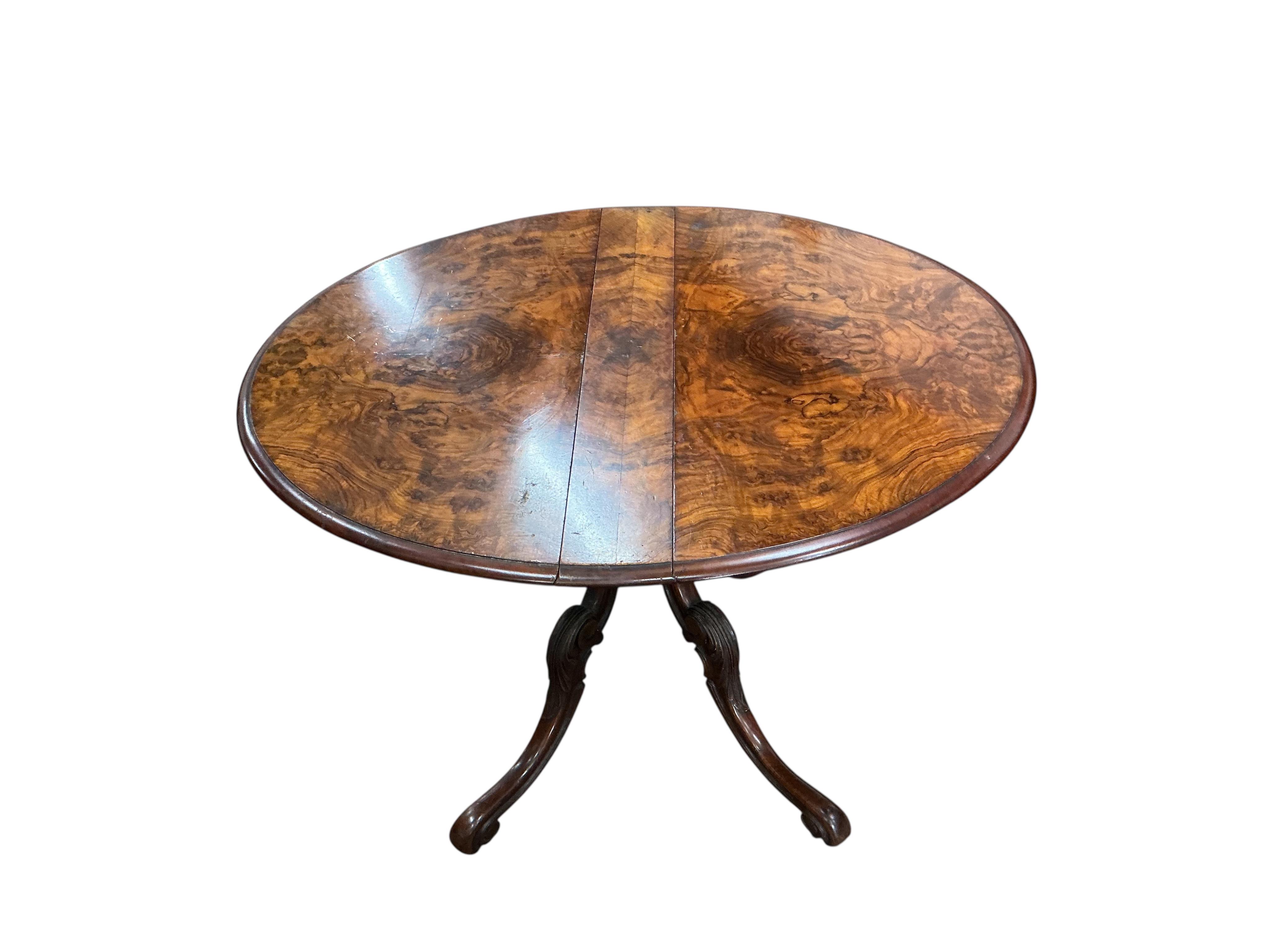 A Victorian burr walnut Sutherland table, width 91cm, height 73cm